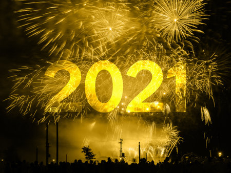 Happy new year 2021 card on a golden fireworks backgroundの写真素材