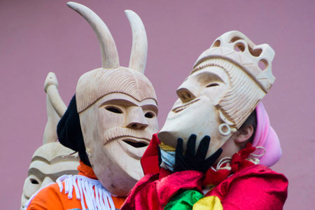 Unidentified people with traditional masks at the annual festival of cultures.の写真素材