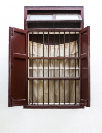 Vintage brown woooden window on white wallの写真素材