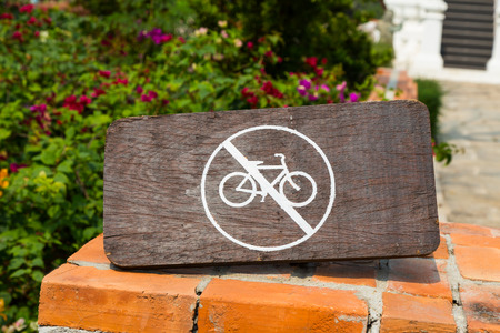 White no bicycle sign on wood