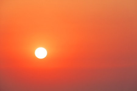 Sun and orange sky for backgroundの写真素材