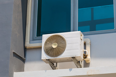 Fan coil air conditioner installed outside buildingの写真素材