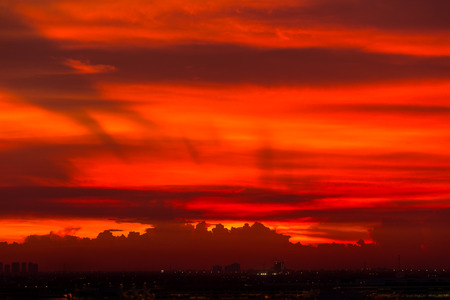 Red sky and cloudscape over airport after sunsetの写真素材