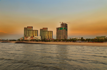 Evening light on construction and building near beachの写真素材