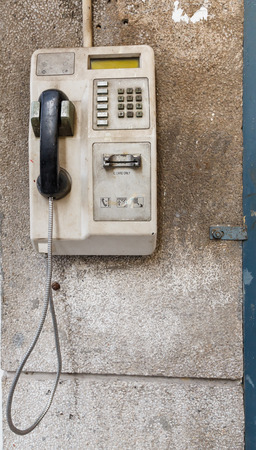 Old public telephone on the wall