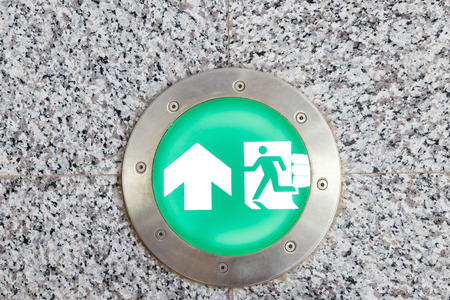 Exit sign and light to emergency door on floorの写真素材