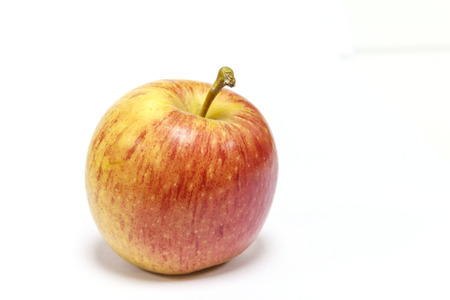 Red yellow apple on white with clipping path