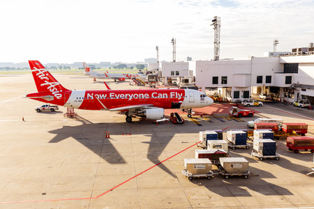 BANGKOK, THAILAND - 12 SEPTEMBER 2015 - Airbus A320-200 Thai Airasia connected to jetway at Don Muang international airport. Thai Airasia is the low cost airline in Thailand.のeditorial素材