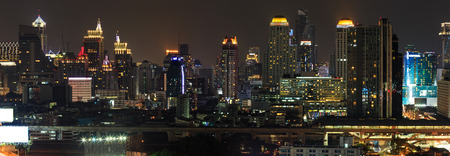 Scene of high-rise buildings and sky train railway at duskのeditorial素材