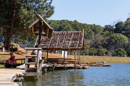 MAE HONG SON, THAILAND - FEBUARY 2: Traveler relaxing on bamboo bridge and hut in lake of Pang Tong on Febuary 2, 2016 in Mae Hong Son, Thailandのeditorial素材