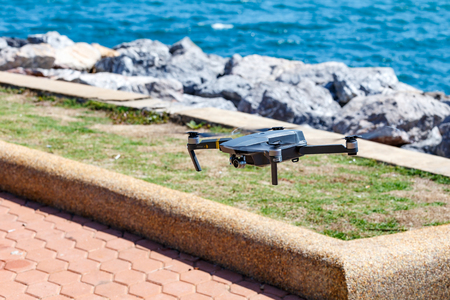 CHANBURI, THAILAND - 11 APRIL 2017 - Unmanned aerial vehical with video camera hovers in the air. This is DJI Mavic Pro model.のeditorial素材