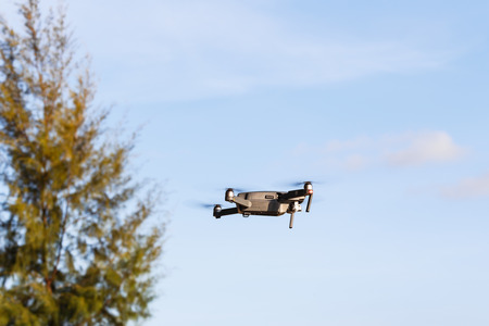 CHANBURI, THAILAND - 11 APRIL 2017 - Unmanned aerial vehical with video camera hovers in the air. This is DJI Mavic Pro model.のeditorial素材