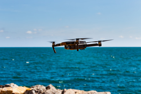 CHANBURI, THAILAND - 11 APRIL 2017 - Unmanned aerial vehical with video camera hovers in the air. This is DJI Mavic Pro model.のeditorial素材