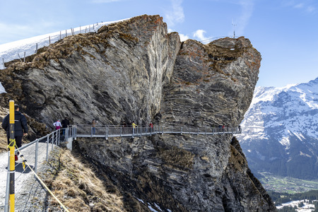 GRINDELWALD BERNE, SWITZERLAND- APRIL 24:Traveller are walking on sky cliff walk at First peak of Alps mountain Grindelwald Switzerland , APRIL 24,2018, Berne, Switzerland. Traveller are walking on sky cliff walk at First peak of Alps mountain Grindelwaldのeditorial素材