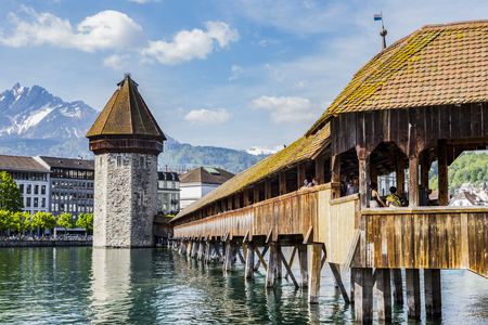 LUZERN, SWITZERLAND - APRIL 25:Chapel bridge famous place on lake Luzern with snow mountain behide, APRIL 25,2018, Luzern, Switzerland. Chapel bridge famous place on lake Luzern Switzerland, Europe.のeditorial素材