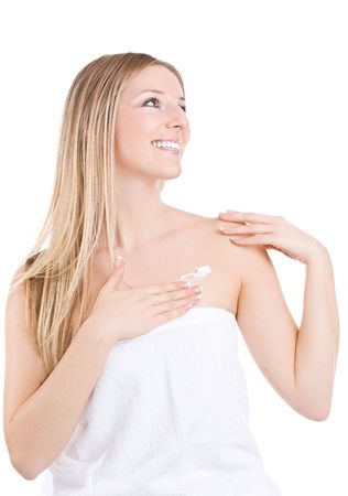 Caucasian woman creaming / moisturising arms and chestの写真素材