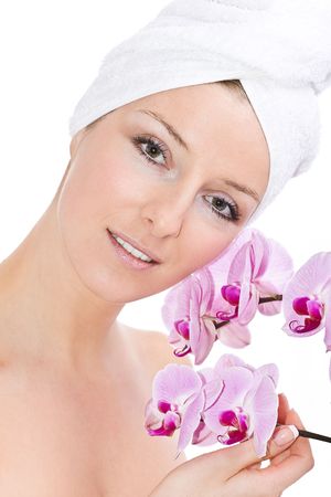Woman with orchid flowers の写真素材