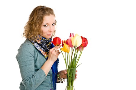 Caucasian young girl with tulips on isolated backgroundの写真素材