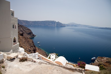 Santorini beautiful volcanic island in Greece landscape with blue churches, windmills and volcanic calderaの写真素材