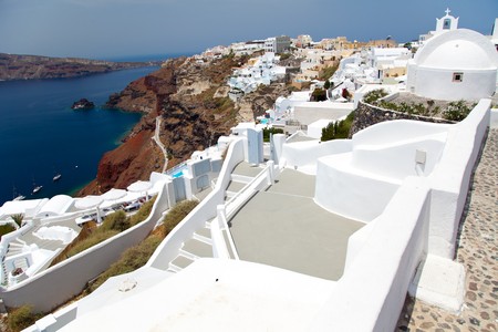 Santorini beautiful volcanic island in Greece landscape with blue churches, windmills and volcanic calderaの写真素材
