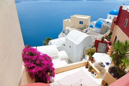 Santorini beautiful volcanic island in Greece landscape with blue churches, windmills and volcanic calderaの写真素材