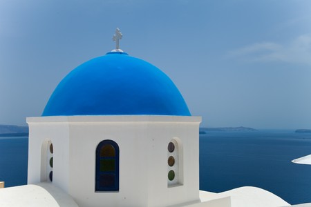 Santorini beautiful volcanic island in Greece landscape with blue churches, windmills and volcanic calderaの写真素材