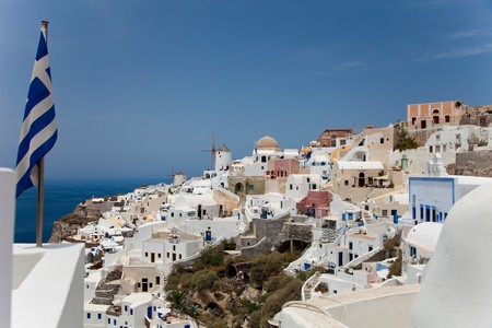 Santorini beautiful volcanic island in Greece landscape with blue churches, windmills and volcanic calderaの写真素材