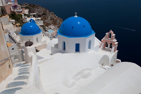 Santorini beautiful volcanic island in Greece landscape with blue churches, windmills and volcanic calderaの写真素材