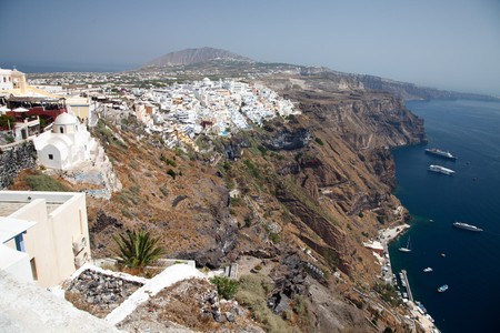 Santorini beautiful volcanic island in Greece landscape with blue churches, windmills and volcanic calderaの写真素材