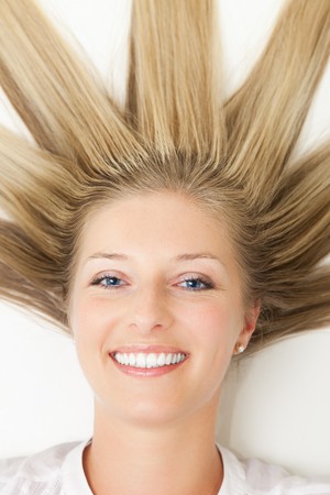 Woman with long sun rays like hair の写真素材