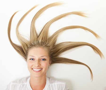 Woman with long sun rays like hair の写真素材