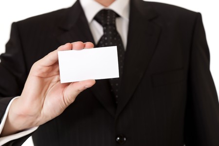 Business man holding blank card on white isolated backgroundの写真素材