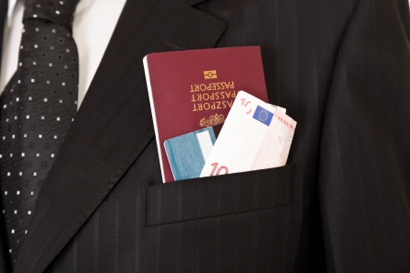 Suit with passport, money and credit cardの写真素材