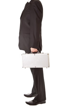 Man in suit holding silver suitcase on white isolated backgroundの写真素材