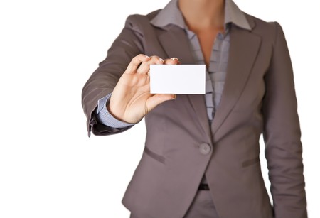 Caucasian blond woman holding blank business card wearing business suit isolatedの写真素材
