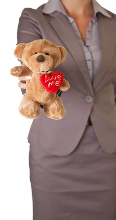 Businesswoman love concept holding teddy bearの写真素材