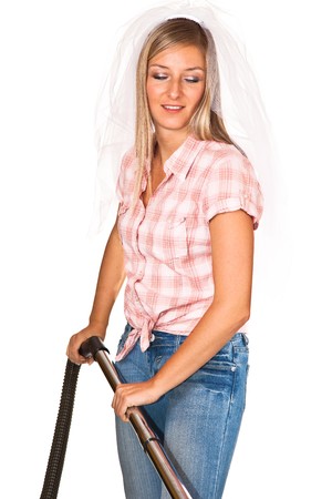 Woman in wedding veil with vacuum cleaner isolated on whiteの写真素材