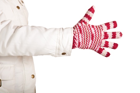 Woman hand in colorful and warm gloves isolated on whiteの写真素材