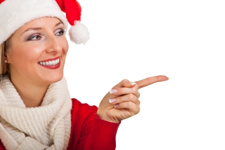 Woman in santa hat with christmas presentsの写真素材