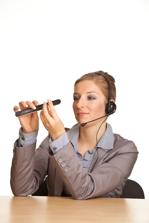 Businesswoman bored in office isolated on whiteの写真素材