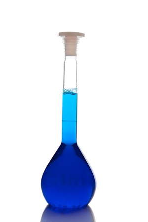 Labolatory glassware with colorful fluids isolated on whiteの写真素材