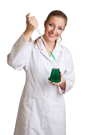 Isolated scientist woman in lab coat with chemical glassware の写真素材