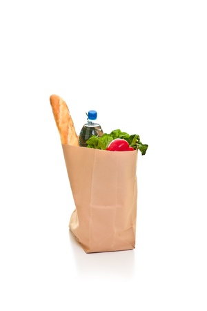 Bag full of groceries isolated on whiteの写真素材