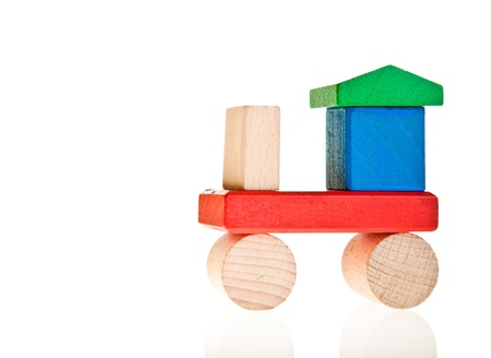 Wooden toy colorful blocks isolated on whiteの写真素材