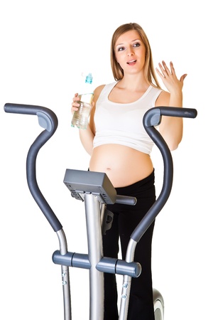 Pregnant woman fitness isolated on whiteの写真素材