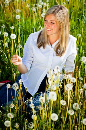 Caucasian woman in spring fieldの写真素材