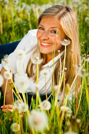 Caucasian woman in spring fieldの写真素材