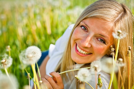 Caucasian woman in spring fieldの写真素材