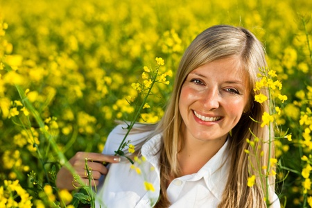 Caucasian woman in spring fieldの写真素材