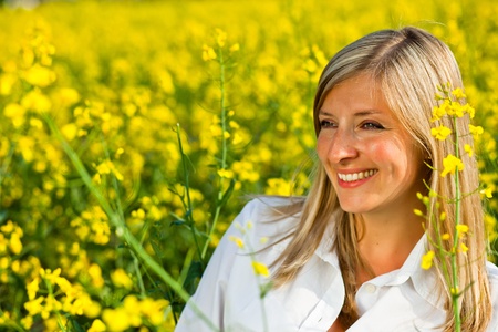 Caucasian woman in spring fieldの写真素材